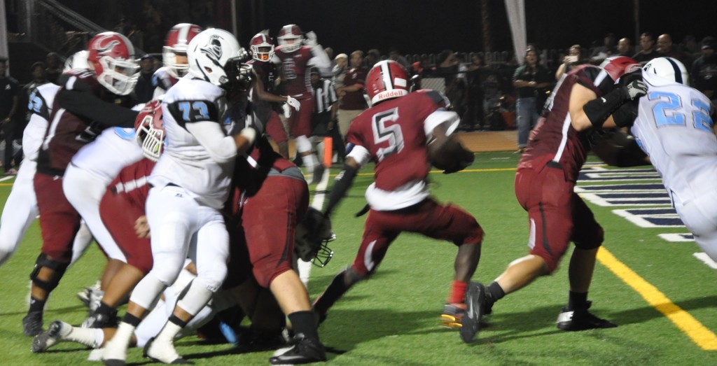 Did Covina's Deonte Bevel make it out of the end zone? Photo by Joe T.