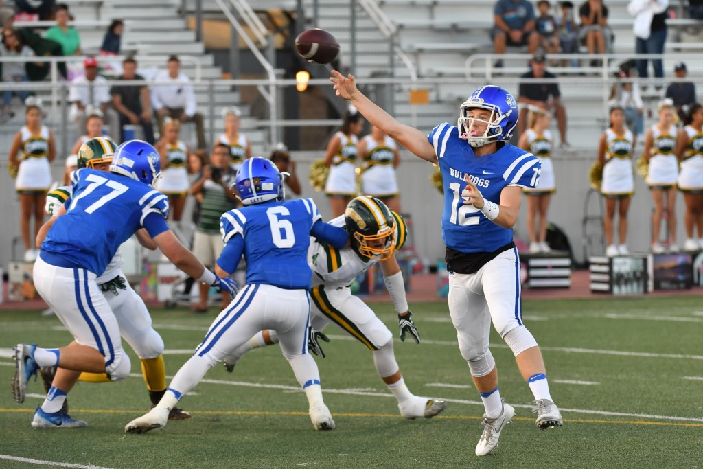 Bulldogs quarterback Guy Gibbs delivering the ball in beautiful downtown Burbank. (Photo by Doug Brown)