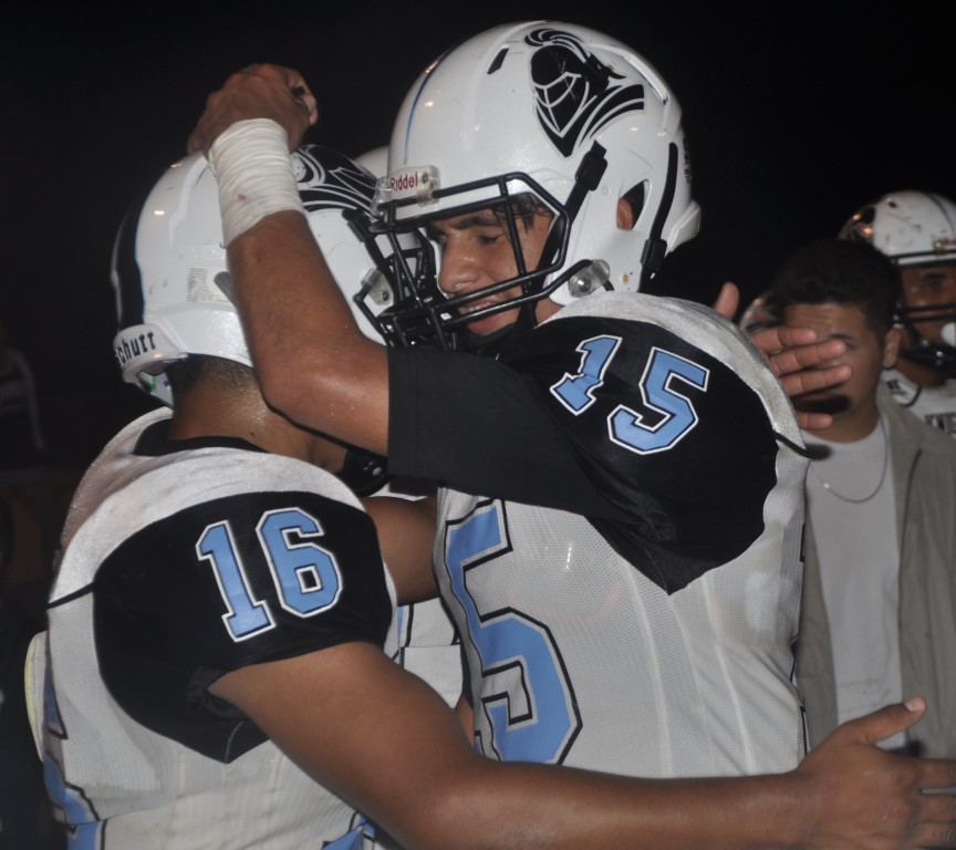 Ernest Camacho (#15) and Daniel Martinez (#16)...celebrates the Knights 38-14 victory over the Southmen. (Photo by Joe T.)