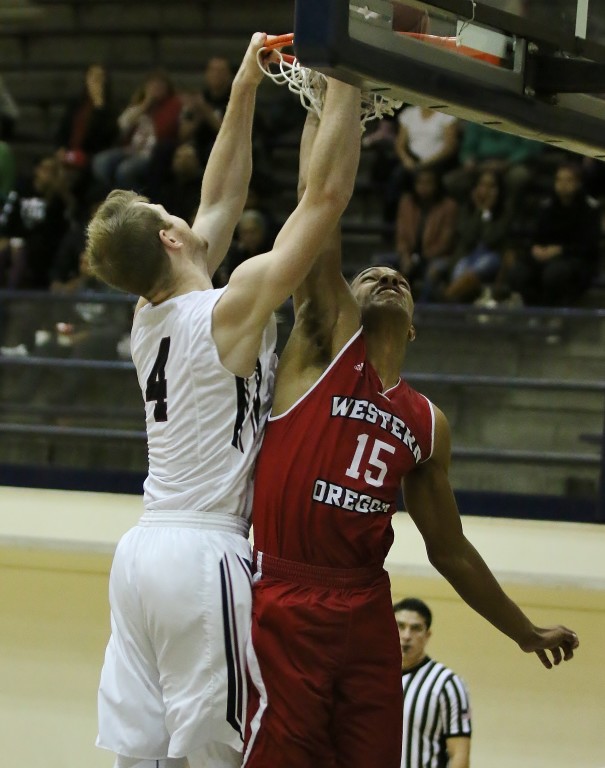 Joey Schreiber slams two home against Western Oregon. (Photo by Duane Barker)